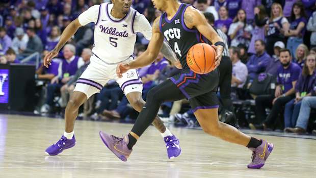 Feb 17, 2024; Manhattan, Kansas, USA; TCU Horned Frogs guard Jameer Nelson Jr. (4) is guarded by Kansas State Wildcats guard Cam Carter (5) during the first half at Bramlage Coliseum. Mandatory Credit: Scott Sewell-USA TODAY Sports  